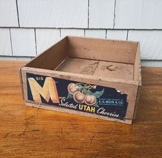 an old wooden crate sitting on top of a table