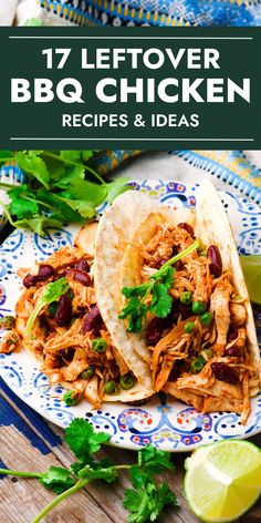 two shredded chicken tacos on a blue and white plate with cilantro garnish