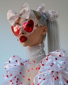 a mannequin with red sunglasses and white hair