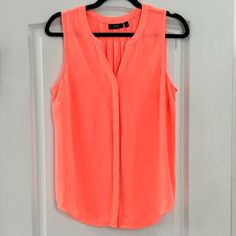 Apt. 9 Sleeveless Coral Blouse. Size Medium. Loose Fitting. Bright Coral Color As Shown In Picture. Like New - Never Worn. Casual Sleeveless Camisole For Work, Summer Sleeveless Camisole For Workwear, Pink Tank Top For Summer Workwear, Orange Cotton Beach Blouse, Orange Beach Tops With Button Closure, Orange Button-up Tops For Summer, Cheap Orange Button-up Blouse, Vibrant Orange V-neck Top, Coral Blouse