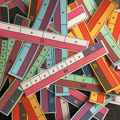 a pile of colorful rulers laying on top of each other