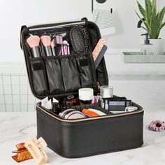 Keep your cosmetics and accessories organized and ready to go at a moment's notice with this Black Cosmetic Train Case Organizer with Adjustable Sponge Divider. This attractive case is the perfect traveling size and features a single two-way zipper on a wide opening, a zippered compartment and PVC divider in the lid, an adjustable sponge divider, and an easy-carry handle on top. The large, open interior space has enough room to keep all of your cosmetic and accessory items secure and in one plac Semester At Sea, Cosmetic Train Case, Black Cosmetics, Travel Makeup Bag, Train Case, Packing Tips For Travel, Christmas 2023, Makeup Bags Travel, Accessory Organization