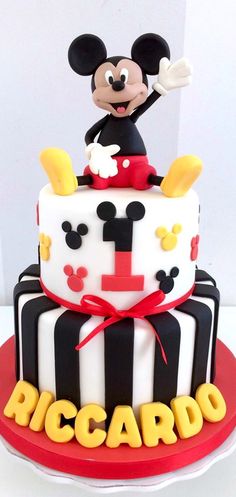 a mickey mouse birthday cake on a table