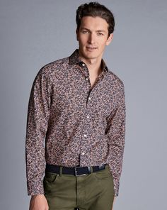 100% cotton, Available in classic and slim fit, Made with Liberty fabric, made in Italy, Semi-spread collar, Rounded button cuff with one button, Classic and slim fit: back pleats, Machine washable - Made With Liberty Fabric Floral Print Semi-Cutaway Collar Shirt - Pink | Men's Charles Tyrwhitt Made With Liberty Fabric Floral Print Semi-Cutaway Collar Shirt - Pink Size Large Cotton Fitted Cotton Dress Shirt With Casual Collar, Fitted Dress Shirt With Casual Collar For Work, Classic Fitted Collared Tops, Fitted Cotton Dress Shirt For Fall, Casual Fitted Dress Shirt With Concealed Placket, Semi-formal Slim Fit Dress Shirt With Casual Collar, Slim Fit Dress Shirt With Casual Collar, Fitted Button-up Tops With Welt Pockets, Classic Fitted Shirt With Casual Collar