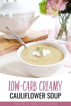 low - carb creamy cauliflower soup in a white bowl