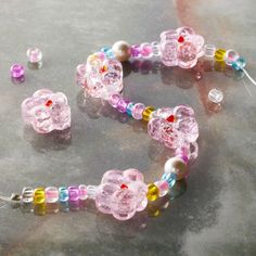 a necklace and earring made out of glass beads