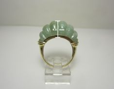 "This unique and one of a kind ring was crafted in 14k yellow gold. It features a natural jadeite gemstone with a fancy cut. Ring size 7 Markings: \"14k 585\" on the inside of the band (pictured). Weight: 6.2 grams This ring would make a great addition to any jewelry collection! The Trading Post is based in Chardon, Ohio. We carry a huge selection of gold and silver jewelry, bullion, numismatic coins, and much more. Check out the rest of our stunning and unique collection. You can also find us a Modern Yellow Gold Jade Jewelry, Modern Jade Cabochon Jewelry, Modern Jade Jewelry For Anniversary, Formal Yellow Gold Jade Ring, Yellow Gold Jade Ring With Gemstone, Chardon Ohio, Numismatic Coins, Gold Heart Ring, Gold And Silver Jewelry