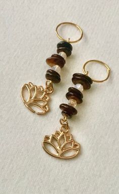 Each order comes with 2 loc charms featuring chip beads dangles with a lotus flower charm Signup for our email mailing list at the link below for updates and special offers https://tinyurl.com/2mh6c8t Brown Hypoallergenic Spiritual Jewelry, Hypoallergenic Brown Spiritual Jewelry, Spiritual Brown Hypoallergenic Jewelry, Black Hair Jewelry, Loc Charms, Braid Accessories, Chip Beads, Jewelry Boho, Rings Wedding