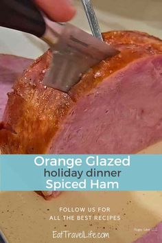 someone is cutting up a piece of ham on a plate with the words orange glazed holiday dinner spiced ham