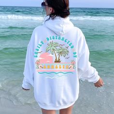 Soak up the serene vibes with our Sunset Summer Hoodie. This cozy sunset hoodie, perfect for beach lovers, captures the beauty of a beach sunset. Ideal for those who are easily distracted by sunsets, this beach sweatshirt blends comfort with a stunning sunset design. Elevate your beachy aesthetic and enjoy the perfect evening with our Sunset Sweatshirt. Whether you're strolling along the shore or relaxing at a bonfire, this beach hoodie is a must-have for your summer wardrobe. White Long Sleeve Hoodie For Beach, Casual Long Sleeve Hoodie For Vacation, Vacation Hoodie With Relaxed Fit And Long Sleeves, Relaxed Fit Long Sleeve Hoodie For Vacation, Casual Beach Hoodie For Beach Season, Long Sleeve Hoodie For Beach Vacation, Long Sleeve Hoodie With Drawstring Hood For Vacation, Beach Hoodie In Vsco Style, Beach Hoodie With Drawstring Hood