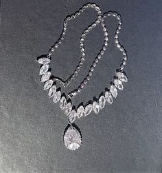 "Chunky CZ Teardrop Necklace , CZ Necklace , Clear Marquise Shaped CZ, CZ Statement Necklace , Silver Chain Necklace                                                                                                                                   Full of Sparkle and dazzling   Silver Necklace is 20\" long / half way down the silver necklace is Marquise Shaped CZ stones and then a Pear shaped CZ which hangs 1 1/4\" . Beautiful Statement Necklace ! Please ask any questions as I do not accept returns! Thank You  I do offer discounts when buying multiple items" Unique Hoop Earrings, Ribbon Necklace, Cz Necklace, Teardrop Necklace, Way Down, Silver Chain Necklace, Cz Stone, Necklace Silver, Pear Shaped