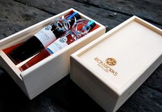 two bottles of wine in a wooden box