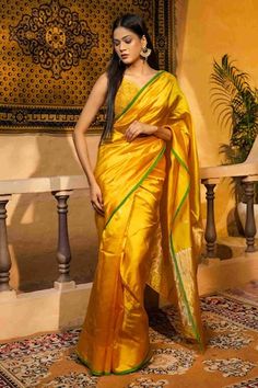 Canary yellow banarasi handloom saree crafted in pure chanderi silk with bloom buta woven details and contrasting green border detailing. Comes with an unstitched blouse piece. - Aza Fashions Saree Gowns, Dhoti Saree, Cotton Sarees Handloom, Sarees Banarasi, Ruffle Saree, Green Border, Drape Saree, Green Saree, Lehenga Saree