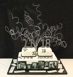 two tiered cake with white frosting and photos on it