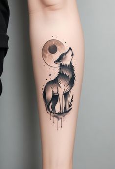 a woman's leg with a tattoo of a wolf and the moon on it