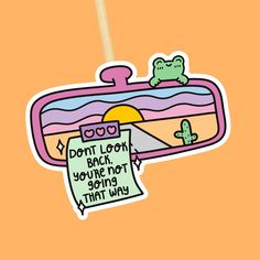 "DON'T LOOK BACK, YOU'RE MOT GOING THAT WAY - STICKER 🌵🐸 This motivational sticker is waterproof, weatherproof and dishwasher safe so it can stick pretty much anywhere! 🌸 Please select any add ons you would like, or just select \"Single Sticker\" if you would just like the sticker on its own. QUICK NOTES: - Dishwasher Safe when washed at a low temperature - Waterproof - Has an easy peel tab! - Handmade Make your own sticker pack right here 👇🏻 https://www.etsy.com/listing/1543393409/custom-mental-health-sticker-pack SIZE: 2.75 Inches (7cm) at the longest side ADD ONS: Mystery Sticker - Your mystery sticker with relate to this main sticker and will look amazing along side it. The second sticker will be at a discounted rate of just over 30% 💸 5x7 Print - These will be a print of this st Single Stickers Aesthetic, Positive Quote Stickers, You Look Amazing, Don't Look Back You're Not Going That Way, Funny Mental Health Puns, Don’t Look Back, Quotes For Stickers, Motivating Stickers, Cool Stickers Aesthetic