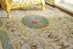 a miniature bed sitting on top of a rug