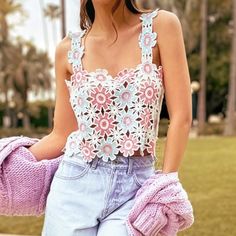 Give Your New Season Wardrobe The Upgrade It Deserves With This Multi Floral Crochet Crop Top. This Crop Top Is Brought To You In A Multi Floral Crochet Material With A Cropped Length, How Could You Resist This? This Crop Top Is Calling Your Name Doll. Just Add Denim Jeans, Sandals And Accessories To Complete The Look. Length Approx 33cm/13" (Based On A Sample Size Uk 8) Model Wears Size Uk 8/ Eu 36/ Aus 8/ Us 4 Model Height - 5ft 9.5" Length May Vary Due To Crochet Knit Print May Vary Spring Lace Crochet Top, Chic Pink Tops With Crochet Trim, Pink Sleeveless Lace Crop Top, Pink Lace Sleeveless Crop Top, Trendy Crochet Lace Tops For Spring, Fitted Crochet Trim Top For Spring, Fitted Crochet Top With Crochet Trim For Spring, Pink Cotton Crochet Top With Crochet Trim, Pink Crochet Trim Cotton Top