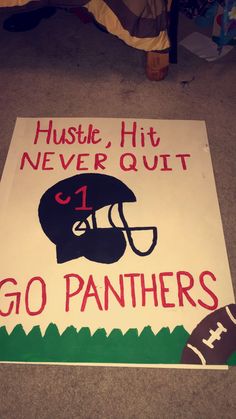 a sign that says hustle, hit never quit go pantheres on the floor