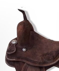 a brown leather saddle with an embellishment on it