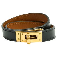 Hermès Kelly double-wrap bracelet in smooth black leather and gold metal, size 2 (for a 15.5 cm or 6.1 in wrist), leather width 1.2 cm, year 2013, delivered in its original pouch and box. The metal parts have tiny scratches and the bracelet may be from private sales but it is in excellent condition, lovely on the wrist ... Kelly Bracelet, Hermes Bracelet, Modern Bracelets, Double Wrap Bracelet, Bracelet Box, Arm Band, Wrap Bracelet, Metallica, Gold Metal