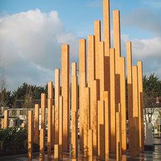 a large wooden sculpture sitting in the middle of a park