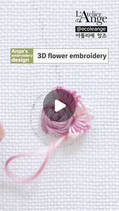 the video is showing how to make a flower embroidery with yarn and thread