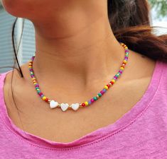 Multicolor Beaded Choker necklace  Beautiful delicate necklace great to wear on summertime, festival, party, vacation, holiday, banquet, beach or everyday wear. ▪️These cute necklaces are made with 3mm multicolor glass beads, 18k gold brass spacer beads, nylon cord 0.5mm, Shell. ▪️ Size: 17 inches long. ▪️All orders go inside a box already prepared as a gift. ▪️100% handmade items. ▪️It is not recommended to contact the jewelry with soap, lotions, perfume or any other harmful chemicals to use it Multicolor Heart Beads Jewelry For Vacation, Colorful Heart Beads Necklaces For Festivals, Colorful Heart Beads Necklace For Festivals, Colorful Festival Necklaces With Heart Beads, Heart-shaped Colorful Beads Jewelry For Beach, Heart-shaped Colorful Beads Summer Jewelry, Summer Heart Shaped Jewelry With Heart Beads, Heart-shaped Colorful Beaded Summer Jewelry, Summer Heart-shaped Jewelry With Colorful Beads