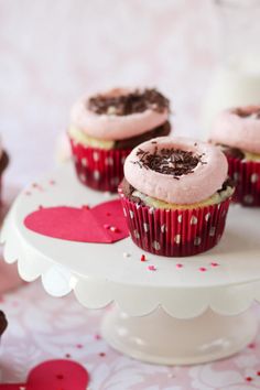 cupcakes with pink frosting and chocolate sprinkles