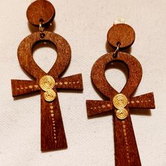 These Are So Unique Afro Centric Ankh Style Medium Size They Are Very Lightweight They Hang 2.5 Inches Metal And Wood Clip On Accent Color With Natural Color Wood Carved Ankh Symbol Great Addition To Any Unique Wardrobe Handmade Adjustable Ankh Earrings, Ankh Symbol, Unique Wardrobe, Wood Clips, Father God, Jewelry Accessories Ideas, Brass Bracelet, Copper And Brass, Wood Carved