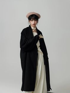 As the days grow shorter and colder, there's one thing we always look forward to this time of year: modernized hanfu coats! The Hou Xue 厚雪 Heavy Snow Trench Coat combines the voluptuous collar styles of the Han Dynasty with a modern trench coat silhouette. Effortlessly chic, and out of this world stylish, make a statement wherever you go with this beauty of a coat. Additionally has pockets to keep your hands warm! When buttoned, the distinct waist lines are a reference to Han Dynasty robes. Inst Black Long Sleeve Kimono For Winter, Long Sleeve Outerwear For Fall Tea Ceremony, Samurai Style Long Sleeve Winter Kimono, Oversized Black Winter Kimono, Oversized Black Kimono For Winter, Modernized Hanfu, Modern Trench Coat, The Han Dynasty, Heavy Snow