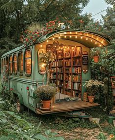 an old bus converted into a library with lights on the windows and bookshelves