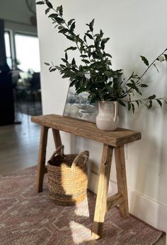 a wooden table topped with a potted plant