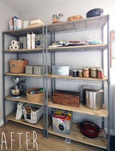 the shelves are organized and ready to be used as shelving units for kitchen storage