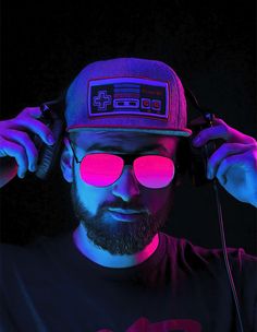 a man with headphones and a hat is wearing neon glasses while listening to music