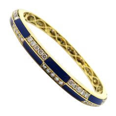 Estate 18K yellow gold 4.60 carat round diamond blue enamel bangle bracelet. Showcasing 77 round brilliant cut micro prong set diamonds weighing a combined total of approximately 3.72 carats. Diamond grading: color grade: G – H. Clarity grade: SI1. The bracelet measures 6.4 mm wide across the top and 50 x 60 mm inner diameter. The inside of the bangle bracelet features openwork detailing. It is secured with a hidden box hinge closure. The total net weight is approximately 28.70 g. Authenticity 1 Antique Bracelets, Enamel Bangle, Enamel Bracelet, Diamonds And Gold, Enamel Jewelry, Ear Jewelry, Gold Bangles, Round Brilliant Cut, Round Brilliant