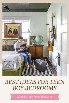 a man sitting on top of a bed in a bedroom