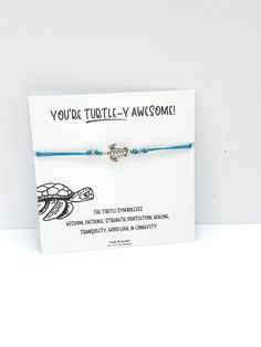 Turtle ankle bracelet - turquoise blue Turtles are frequently depicted in popular culture as easygoing, patient, and wise creatures. Due to their long lifespan, slow movement, sturdiness, and wrinkled appearance, they are an emblem of longevity and stability and protection in many cultures around the world. These pretty ankle bracelets are handmade from waxed nylon cord and metal alloy beads ( no nickel) The anklet opens to 34cm or you can wear it as a bracelet and just re-knot the ends and snip Turquoise Ocean-inspired Bracelets For Gift, Ocean-inspired Turquoise Bracelets As Gift, Turquoise Ocean-inspired Bracelets As Gift, Adjustable Anklets For Summer Gift, Adjustable Summer Anklets As A Gift, Adjustable Blue Anklets As Gift, Adjustable Summer Anklets For Gift, Handmade Blue Anklet As Gift, Personalized Turquoise Friendship Bracelets As Gift