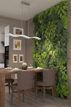 a dining room table and chairs with a green wall in the background