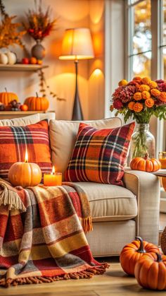 a living room filled with furniture and lots of pumpkins on top of the couch