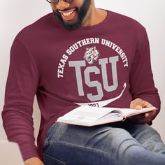 "Custom & Vintage Texas Southern Tigers HBCU College Apparel, Graphic Tees, Hoodies, Sweatshirts, and More University Apparel For Both Texas Southern Students and Texas Southern Alumni. Black owned, HBCU alumni operated apparel company specializing in academic wear. This Texas Southern Tigers product is handmade in Atlanta, GA with materials purchased from local Atlanta vendors. We use only the best material, printing, and packaging. Orders typically ship much faster than posted timeframes.  We Use Bella + Canvas (B6400) 100% Ringspun Cotton and Gildan (G500) 100% Cotton Shirts. Gildan is the default for every item. We've ensured that both models are the same width, length, and chest. There are dozens of models for each brand but those two are the most consistent across the board in look a White Long Sleeve Tops With University Logo, Fan Apparel Long Sleeve Tops With Text Print, Long Sleeve Fan Apparel Tops With Text Print, Long Sleeve Tops With Text Print Fan Apparel, Long Sleeve Tops With Text Print For Fan Gear, Long Sleeve Tops With Text Print For Fans, Long Sleeve Logo Print Tops For Fan Gear, Long Sleeve Tops With Text Print For School Spirit, White Long Sleeve Top With University Logo