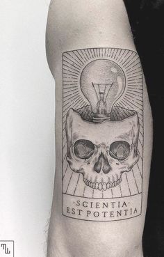 a man's arm with a skull and a light bulb on top of it