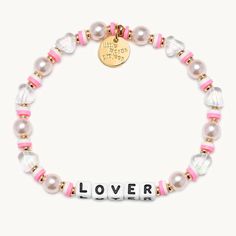 Love the Lover era? Our best-selling Lover bracelet is back with a premium design. We all have a lover in our life, let them know with a bracelet (or keep it for yourself!). Set Kindness in MotionThe cycle of kindness starts with you. It’s why each of our bracelets has a trackable ID tag, so you can one day pass it on and pay its meaning forward. Connect your bracelet to get started! • Hand-crafted, acrylic, faux pearl & silcone beaded bracelet• Plated brass hardware• Elastic stretch bracelet• H Lover Bracelet, Little Words Project, Erin Gray, Lover Era, Lovers Bracelet, The Lover, Purse Jewelry, Id Tag, Premium Design