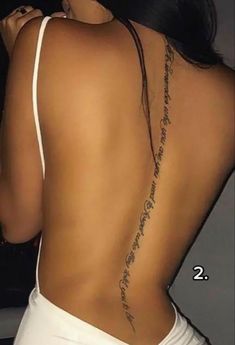 the back of a woman's body with tattoos on it and words written in cursive writing