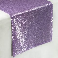 purple sequin table runner on white background