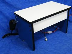 a computer desk sitting on top of a blue floor