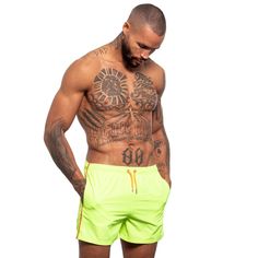 Set yourself apart from the crowd with a fun pair of swim trunks. Perfect above the knee length and comfortable fabric mean you can wear these trunks all day as you enjoy the beach, a pool party, or anywhere else you choose to enjoy them!- Matching drawstring bag included!- Convenient pockets- Elastic waistband with drawstrings- Mesh inner lining- 100% polyester- Machine washable- Made in Turkey- Model is wearing size M- Style #S-166 Yellow Swim Trunks For Summer Beach, Yellow Summer Swim Trunks With Built-in Shorts, Yellow Swimwear With Built-in Shorts For Vacation, Yellow Swim Trunks For Summer, Yellow Swimwear With Built-in Shorts For Poolside, Summer Beach Athletic Shorts In Green, Yellow Summer Swim Trunks For Beach, Yellow Short Swim Trunks For Poolside, Yellow Short Swim Trunks For Beach Season