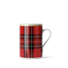 a red and black plaid mug on a white background