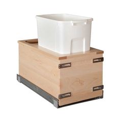 a white container sitting on top of a wooden box with metal handles and two drawers