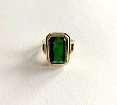 Absolutely stunning green emerald cut real Tourmaline statement ring. This ring is a handmade hallmarked 14ct yellow gold ring set with a large green octagon cut Tourmaline. The fine quality Tourmaline is a beautiful vibrant green and is in excellent condition.  This ring has been made in a classic timeless design and shows off the Tourmaline beautifully.  This ring probably dates from around 2000 +, but is a timeless design and doesn't look worn. The tourmaline will be from Brazil. This stone h Green Stone Ring, Green Tourmaline Ring, Vintage Cocktail Ring, Green Stone Rings, Gold And Green, Gold Ring Sets, Tourmaline Ring, Green Tourmaline, Green Stone